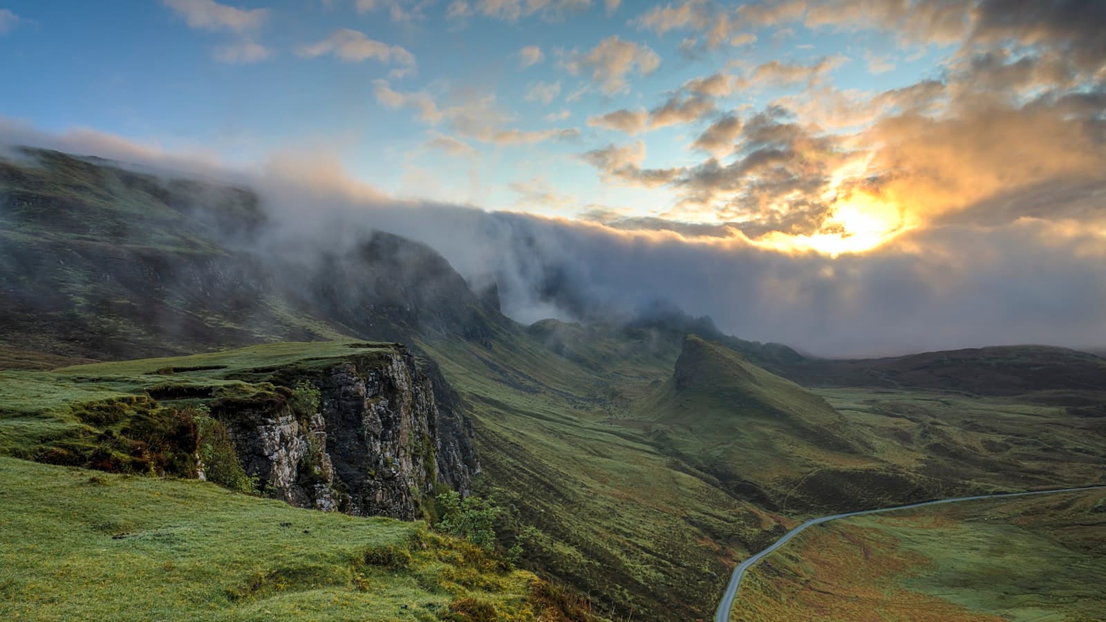 A hillside valley hidden behind low cloud
